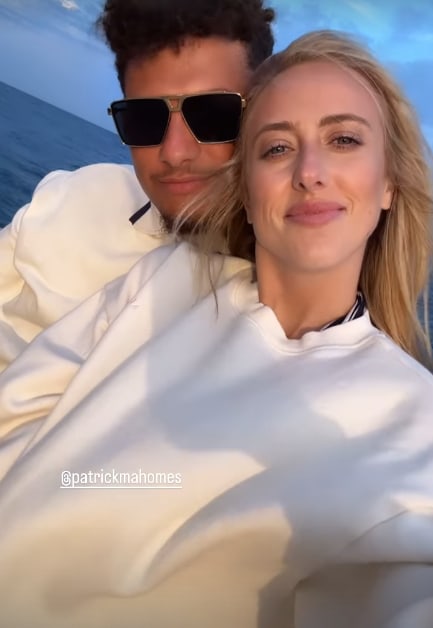 Patrick and Brittany Mahomes in white on a boat