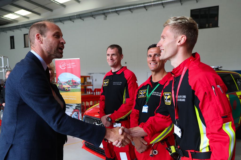 Prince William shaking hands with air ambulance crew in Wales