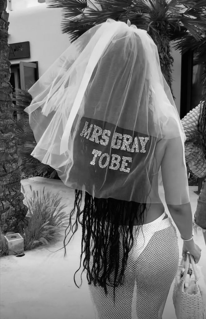 Leigh-Anne Pinnock wears a bridal veil which reads 'Mrs Gray To Be'