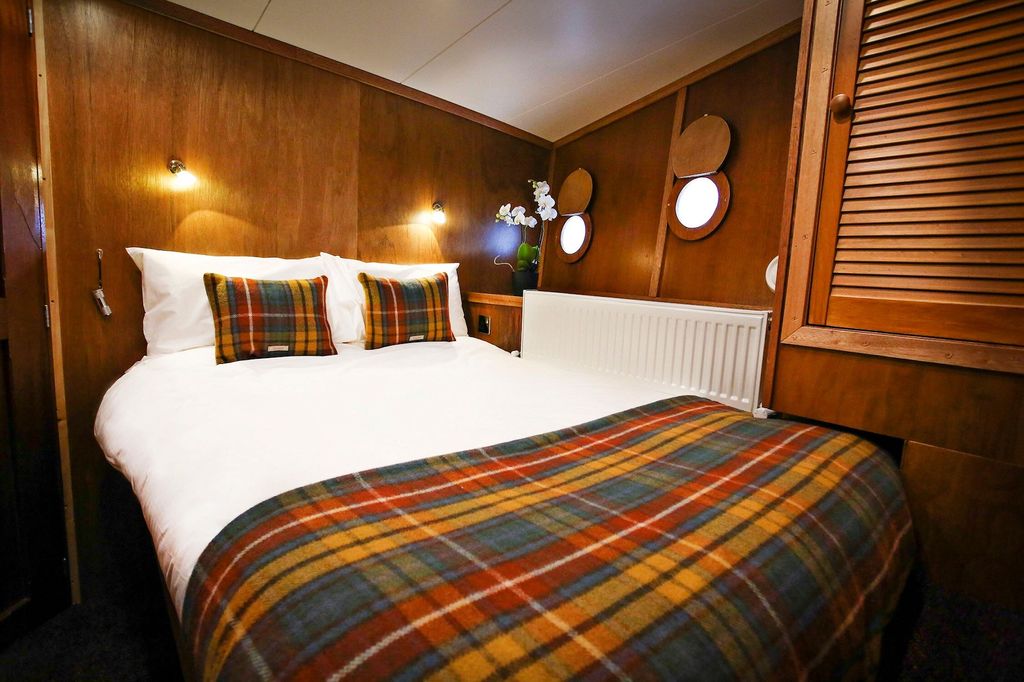 A luxurious bedroom on a Scottish cruise ship