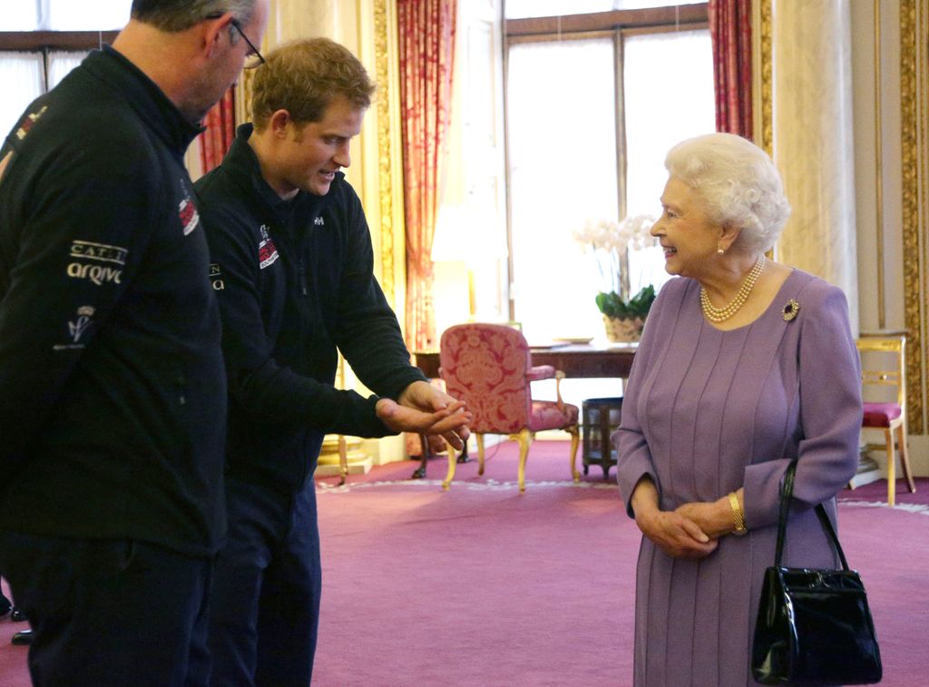 Queen smiling at Harry at palace reception