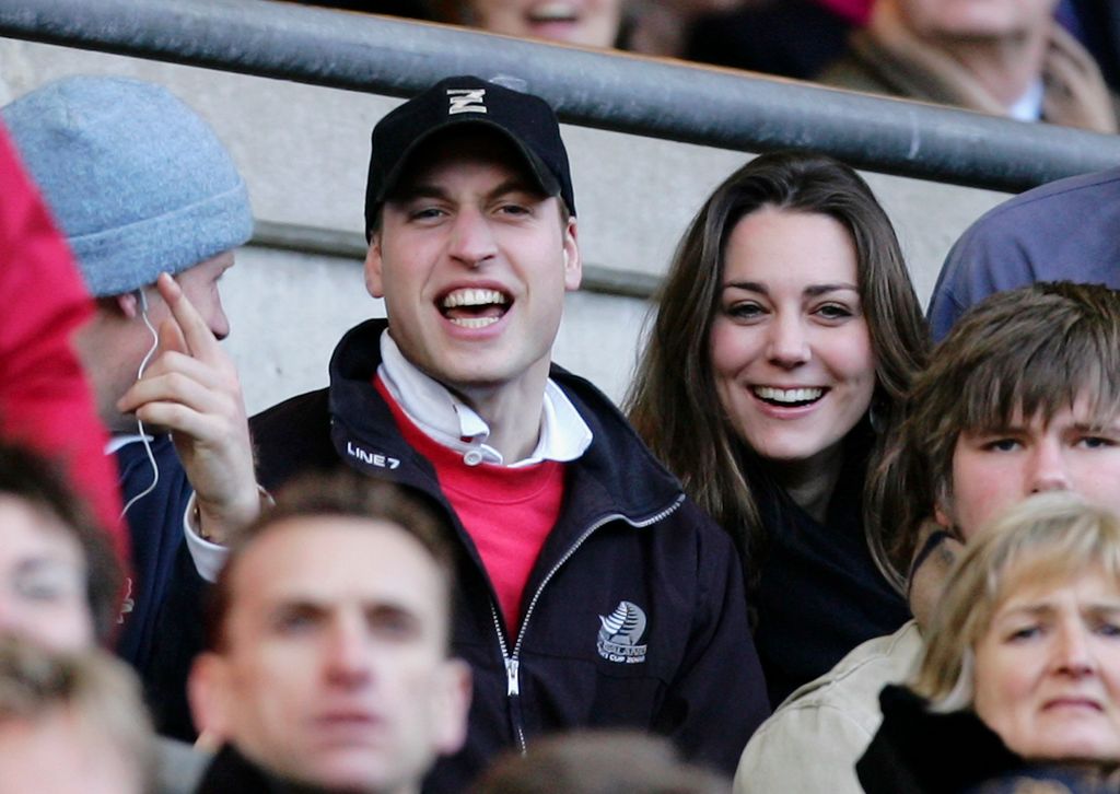 Prince William and Princess Kate smiling and watching rugby in 2007