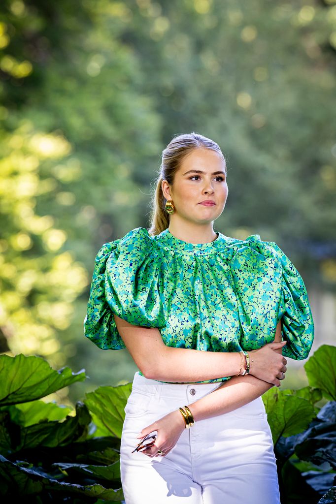 Princess Catharina Amalia wearing green top and white trousers