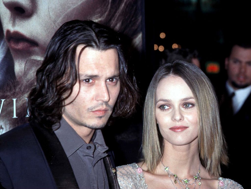 Johnny Depp standing with Vanessa Paradis