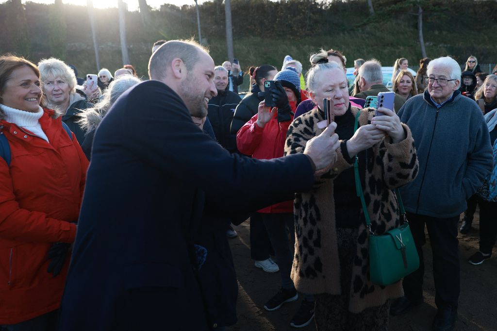 Prince William taking selfie with members of public