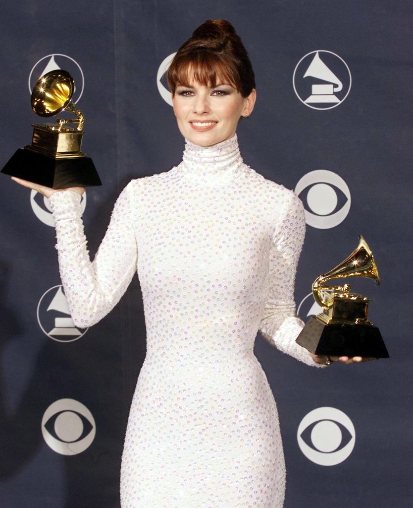 Country music star Shania Twain poses with her two Grammys for Best Country Song and Best Female Country Vocal Performance at the 41st Annual Grammy Awards in Los Angeles, 24 February.