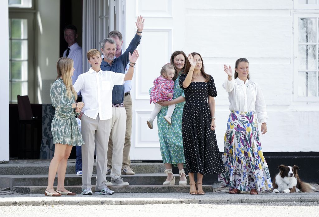 Danish King Frederik X (3-L) and Queen Mary (2-R), with their children Prince Vincent (2-L), Princess Isabella (R) and Princess Josephine (L) wave to spectators a