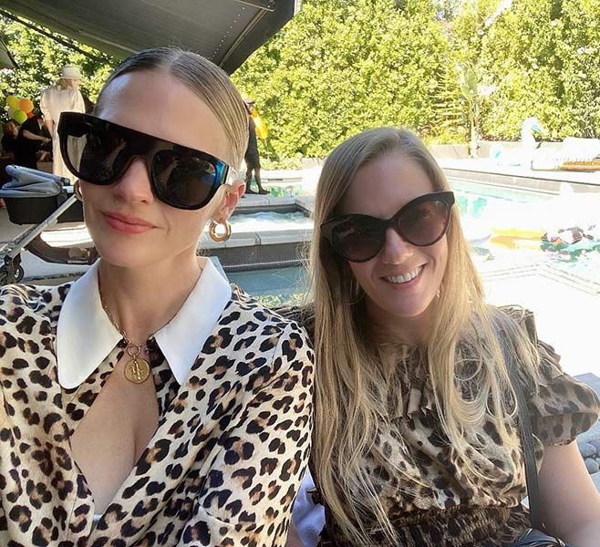 January Jones twins with lookalike sister in plunging animal print in ...
