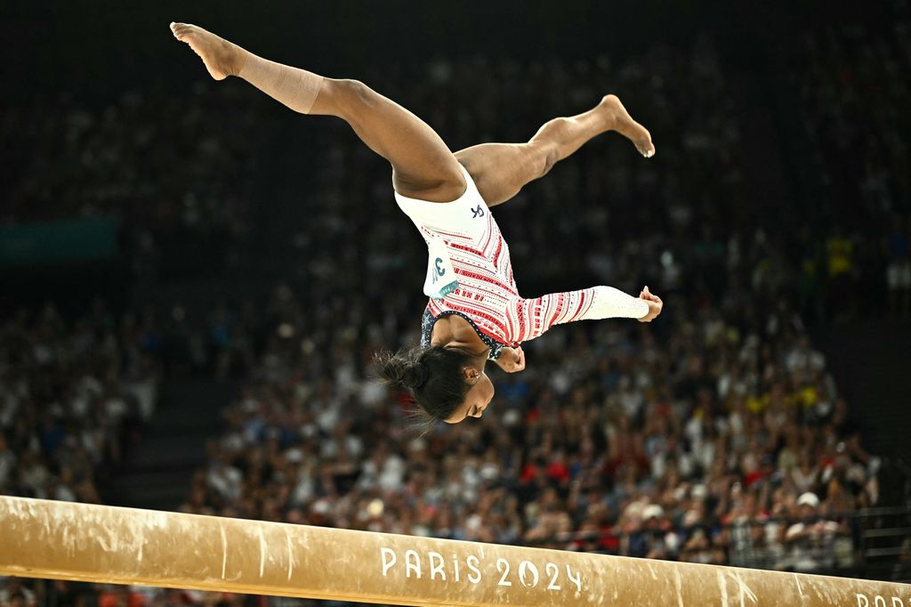 Simone Biles competes in the balance beam event of the artistic gymnastics women's team final