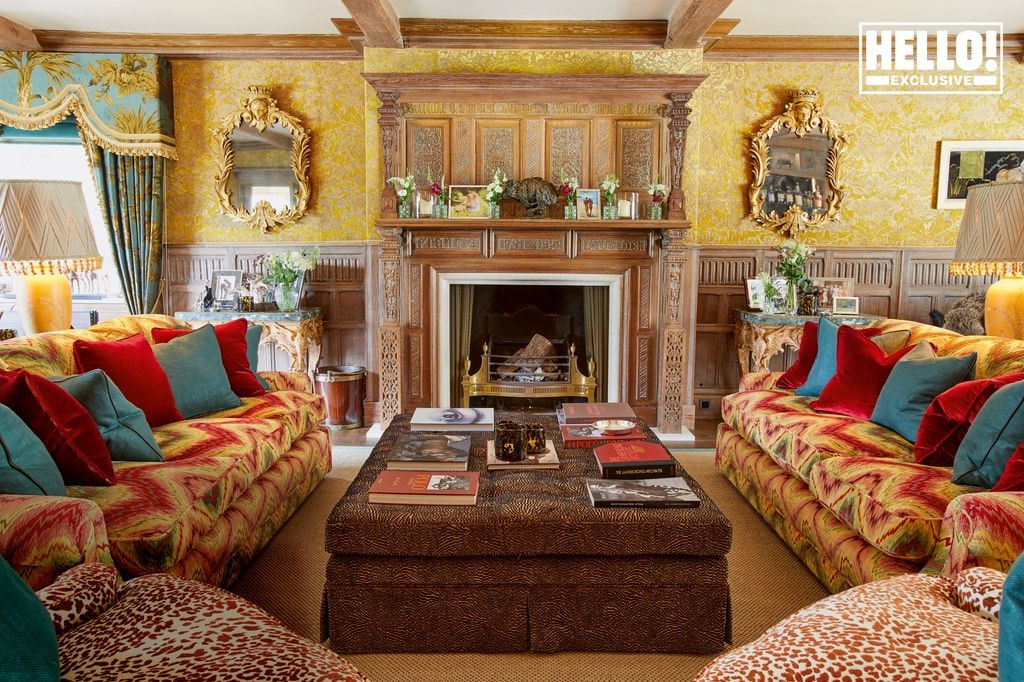 Charlie and Yoanna Hanbury beautiful living room with red blue and yellow sofas