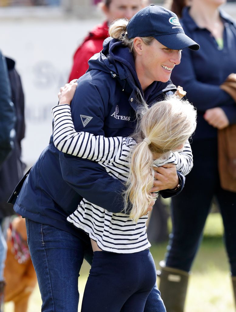 Zara Phillips hugs her niece Savannah Phillips as they attend the Whatley Manor Horse Trials at Gatcombe Park on September 9, 2017 in Stroud, England