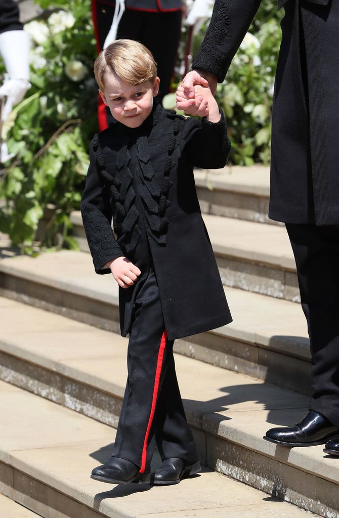 Prince George leaves St George's Chapel at Windsor Castle after the wedding of Prince Harry, Duke of Sussex and Meghan Markle on May 19, 2018 in Windsor, England.