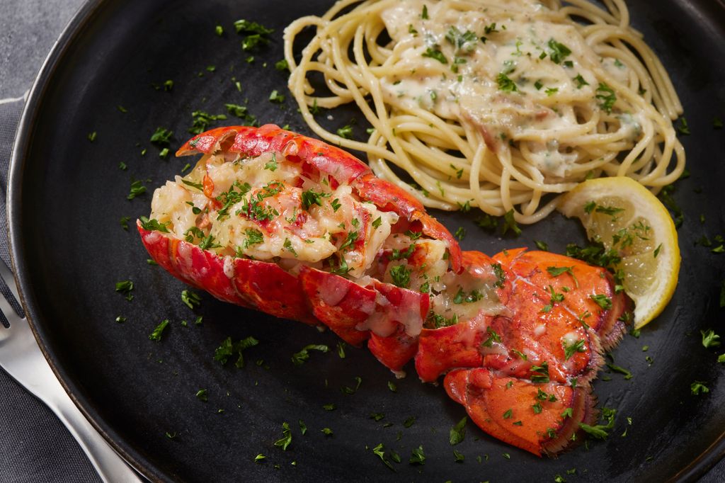 lobster thermidor on black plate