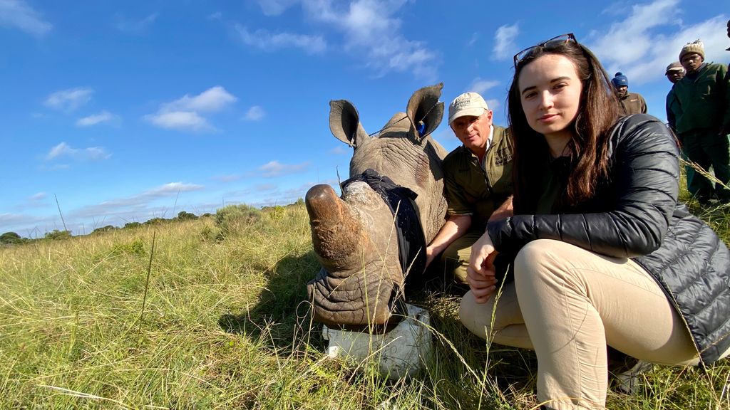 Visiting South Africa in 2022, Megan fits tracking collars to rhinos with wildlife vet William Fowlds