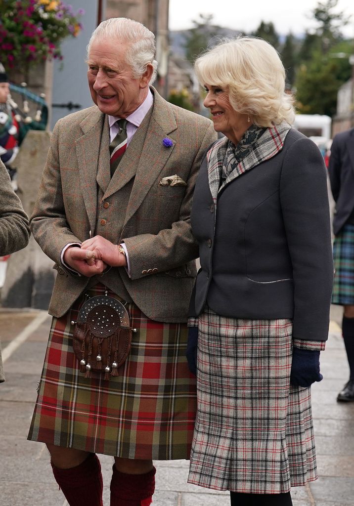 King Charles and Queen Camilla in a kilt and tartan
