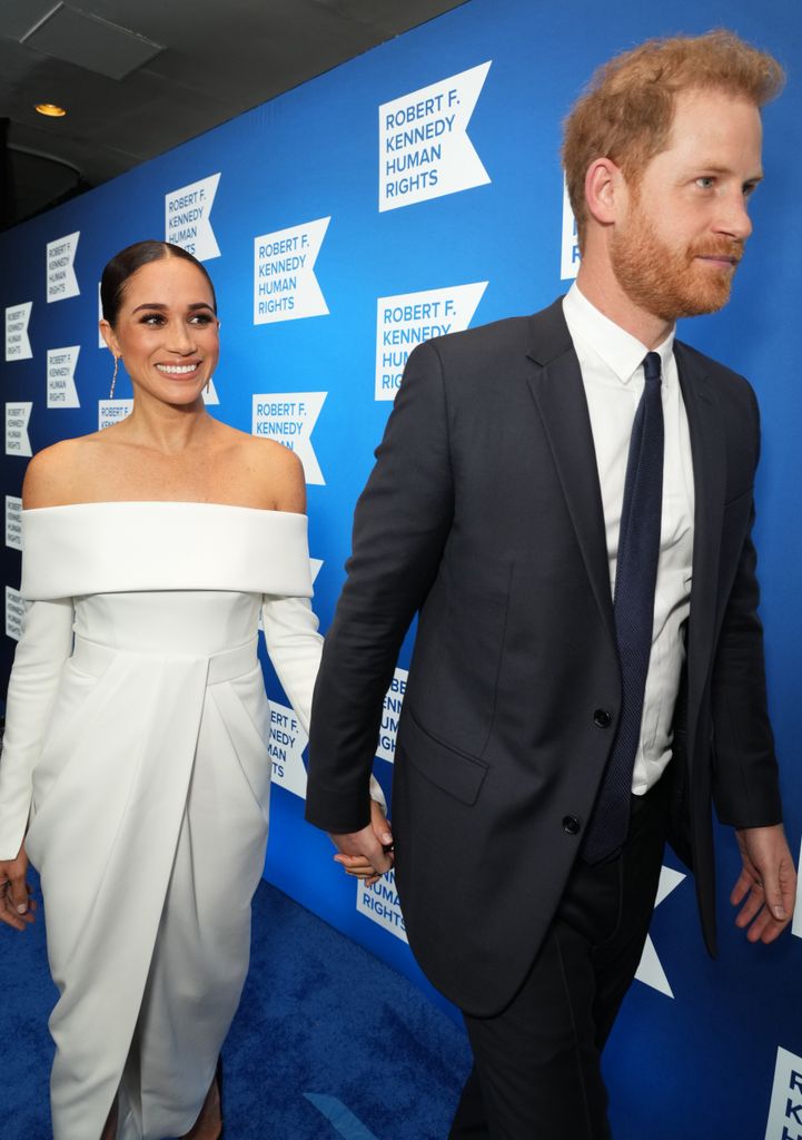 Meghan and Prince Harry on blue carpet