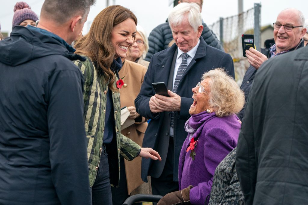 Kate Middleton giggles with a local in Moray, Scotland