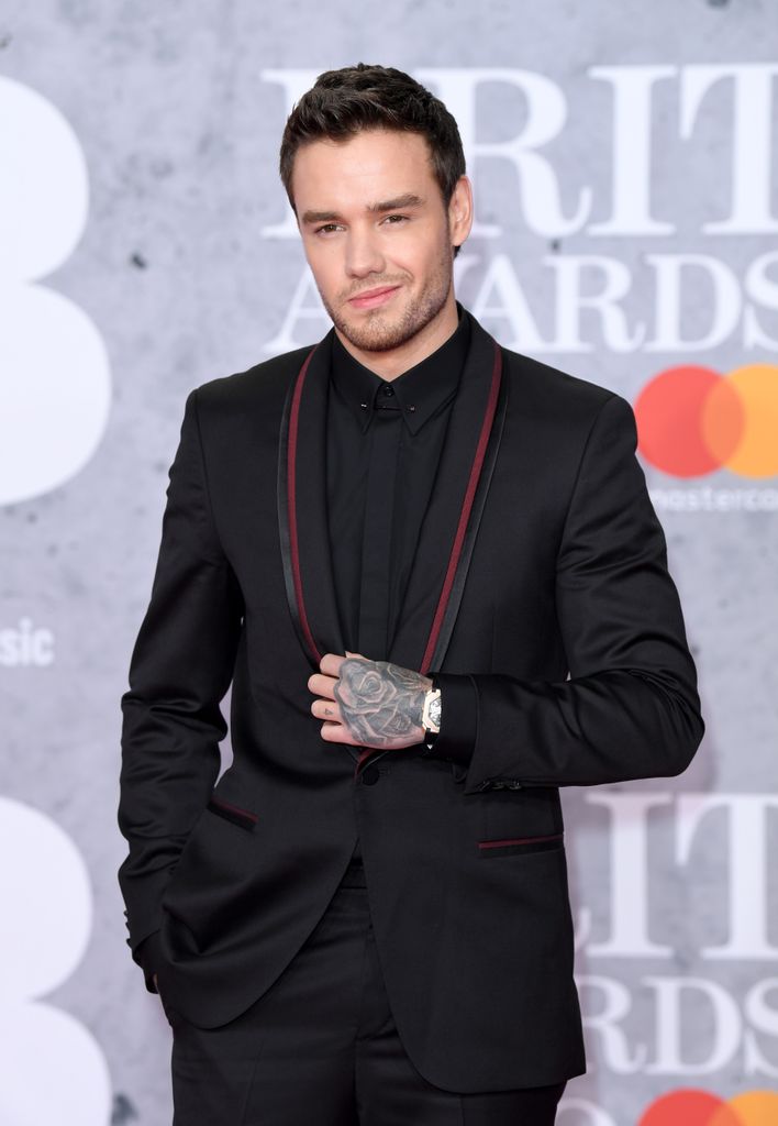 liam payne in black suit on red carpet