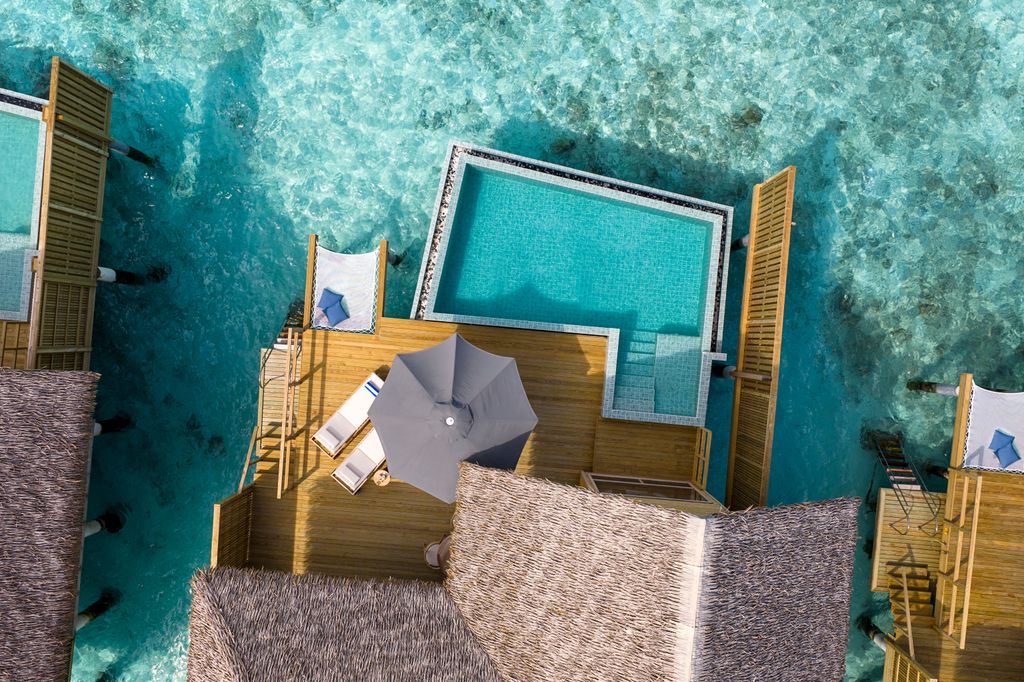 aerial shot of an ocean villa in the maldives 