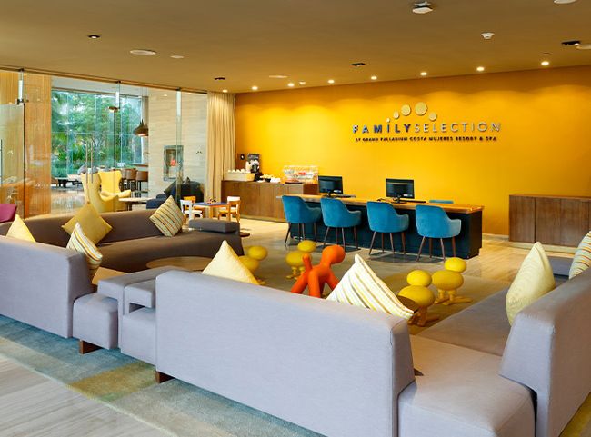 A photo of the Family Selection reception area with large sofa and childrens toys