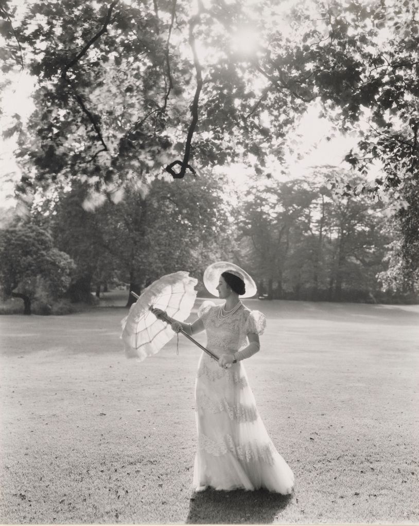 Sir Cecil captures Elizabeth in the Buckingham Palace gardens wearing a Norman Hartnell dress – an image that evokes peaceful times in the year war broke out