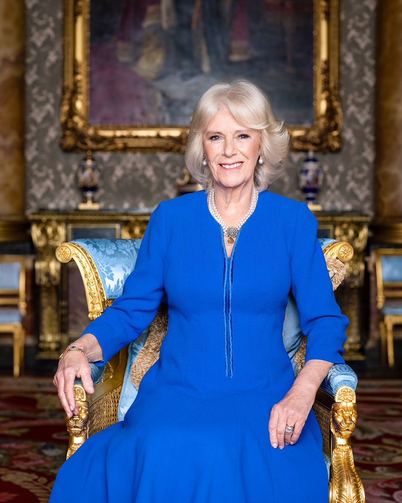 Queen Consort Camilla wearing blue dress in the blue drawing room at Buckingham Palace