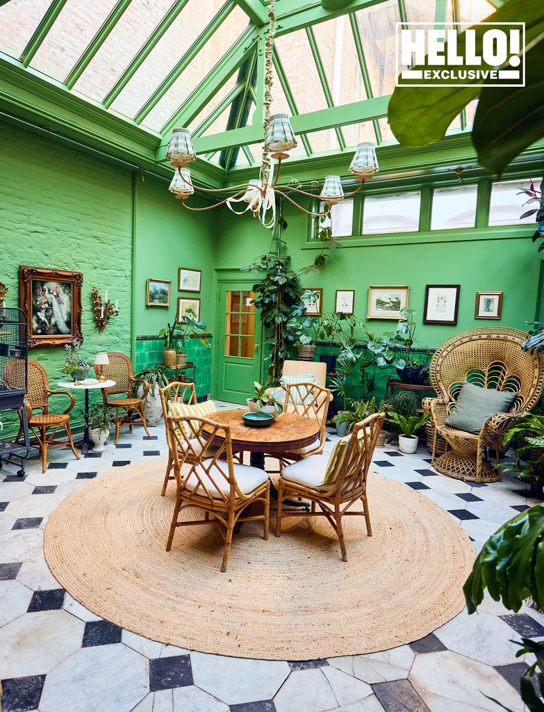 Donna Ida and Robert Walton's green conservatory with wicker furniture at Langdon Court