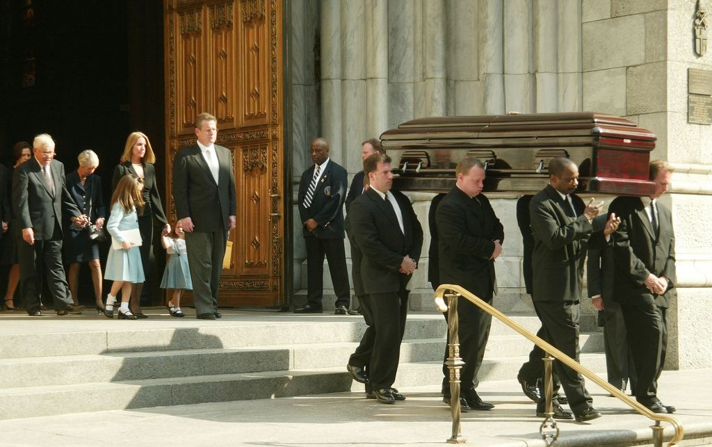 NBC news correspondent David Bloom's casket is carried out followed by his wife Melanie, his daughters and other family members, after a funeral Mass at St. Patrick's Cathedral April 16, 2003 in New York City