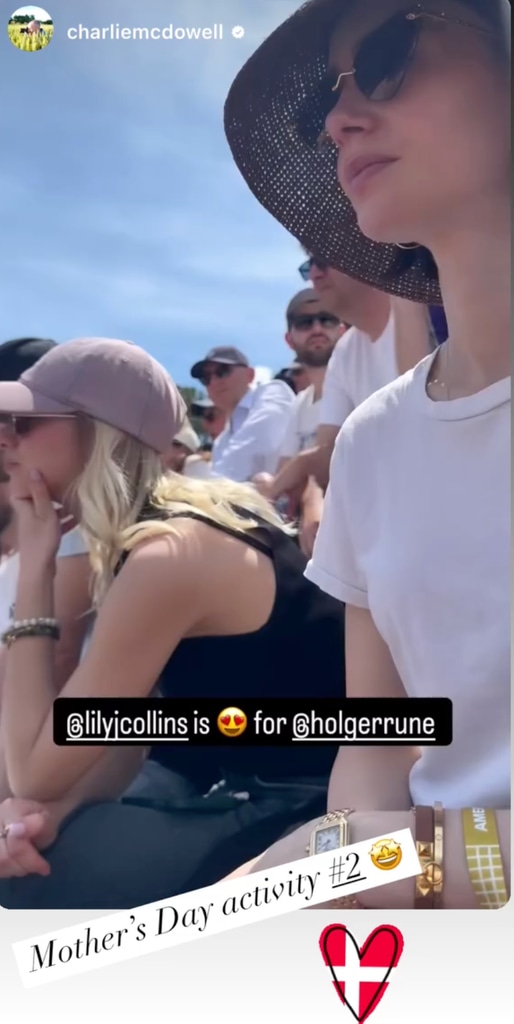 Lily Collins at the Italian Open wearing a white t-shirt and a black summer hat