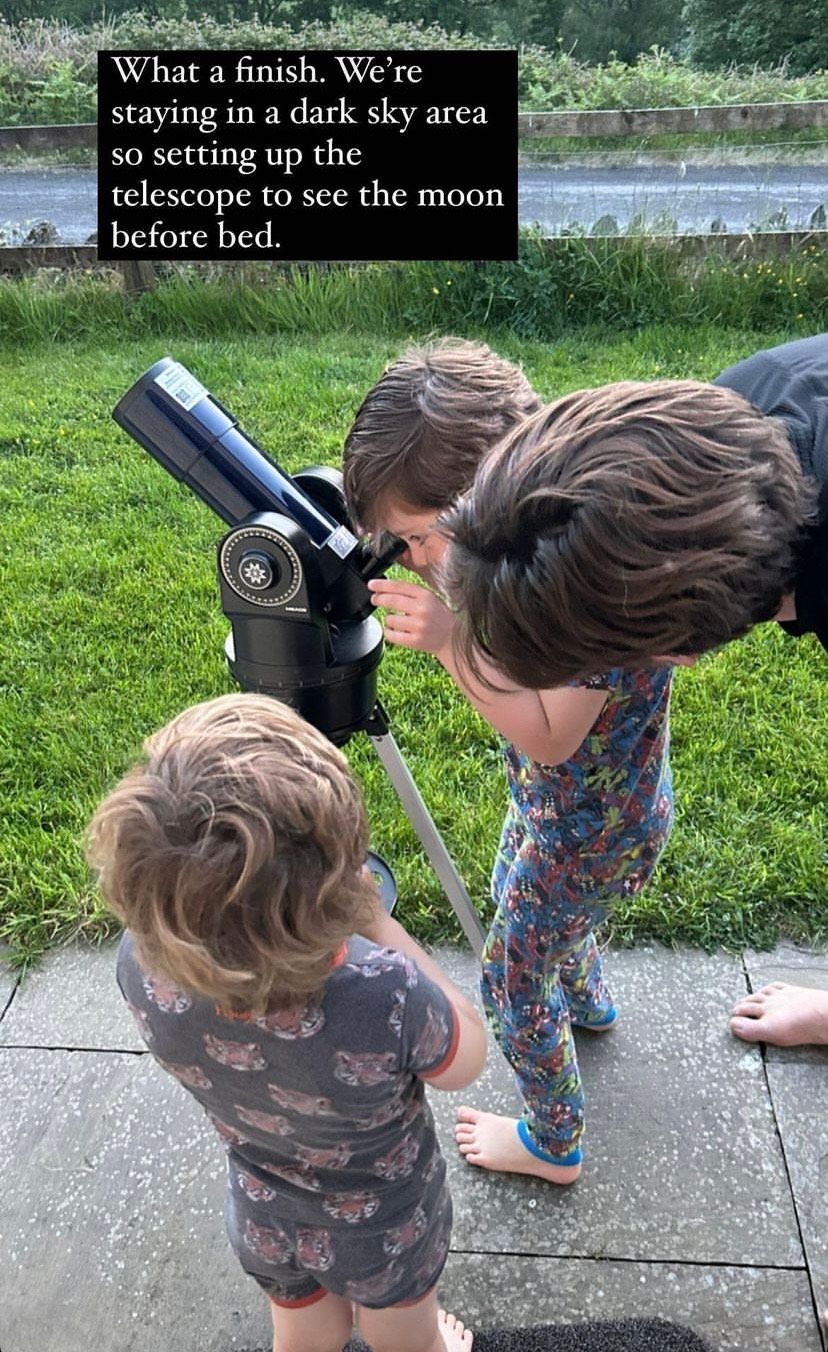 Alex's sons and husband with their telescope