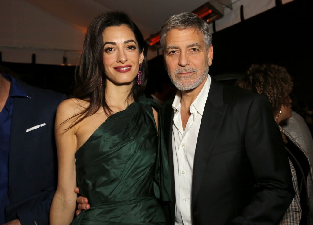 \Amal Clooney and George Clooney attends the premiere of Hulu's "Catch-22" on May 07, 2019 in Hollywood, California.\\