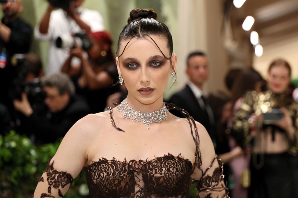 Emma Chamberlain in gothic makeup and a lace dress at the Met Gala