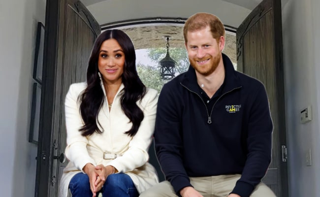 harry and megan in front of double doors