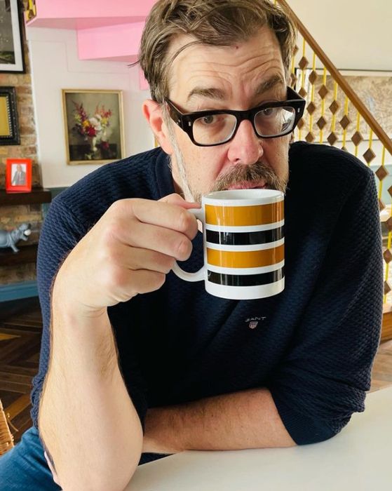 richard osman drinking cup of tea at home