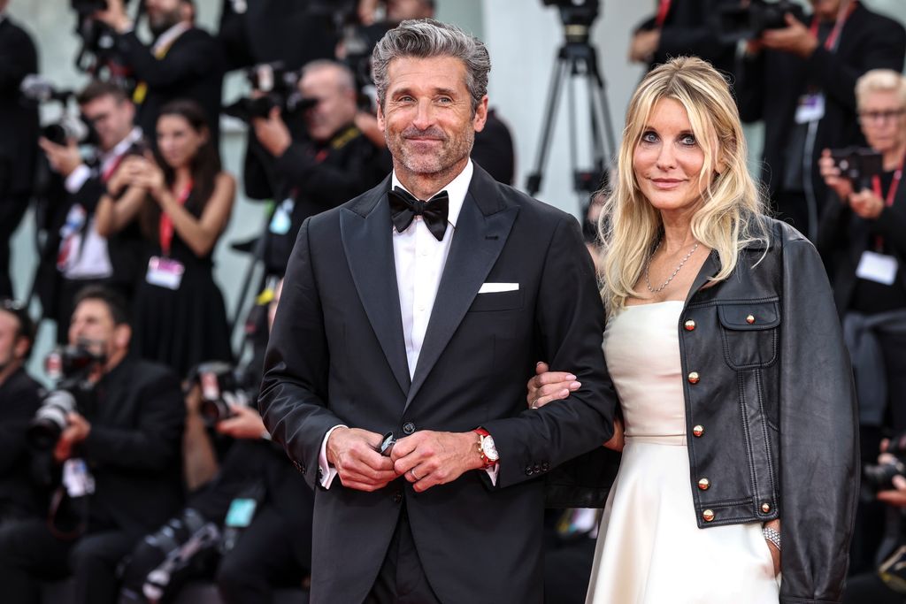 Patrick Dempsey and Jillian Fink attend a red carpet for the movie "Ferrari" at the 80th Venice International Film Festival on August 31, 2023 in Venice, Italy