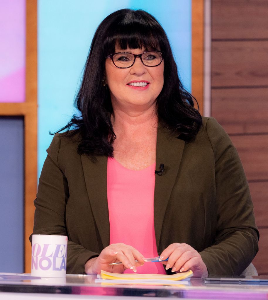 Coleen Nolan in brown jacket and glasses