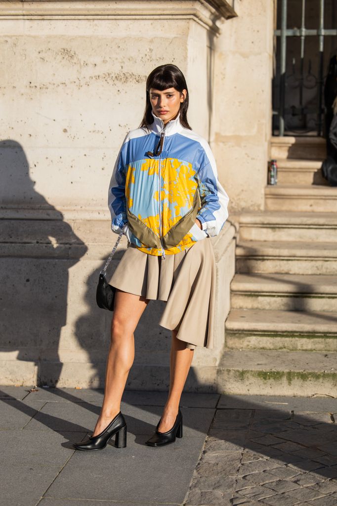 model in pleated skirt
