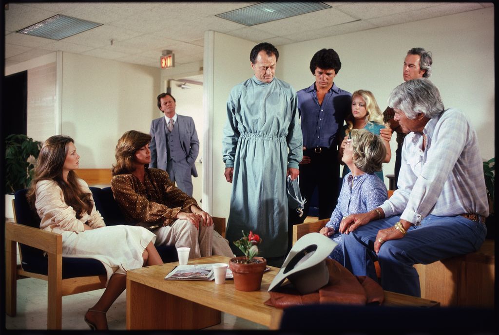 In a scene from the American television series 'Dallas,' cast member gather in a hospital to hear the fate of recently shot character J.R. Ewing in an episode called 'No More Mr. Nice Guy,' June 1980