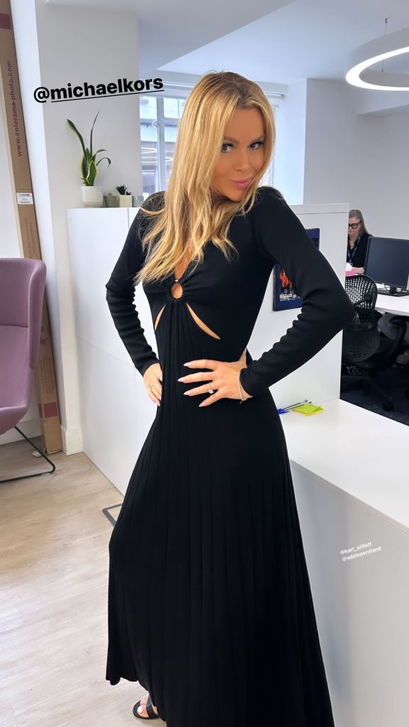 Amanda Holden wearing a black Michael Kors dress