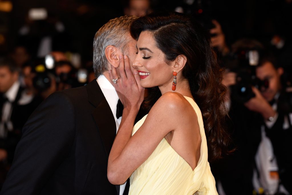 George kissing Amal on red carpet