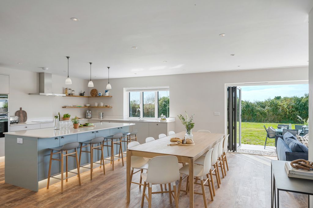 open plan kitchen with doors leading to the outside