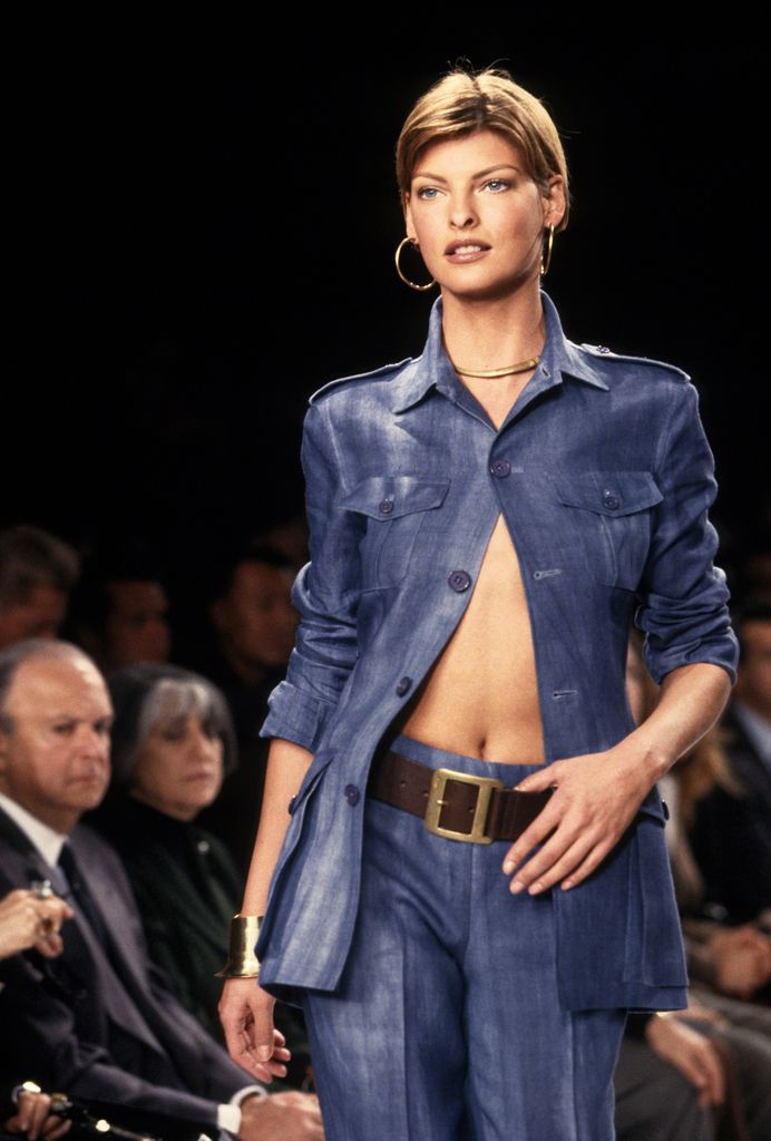 Linda Evangelista in a blue shirt on the runway 