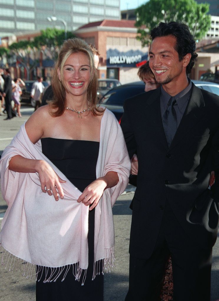 Julia Roberts and actor Benjamin Bratt attend the 'Runaway Bride' Westwood Premiere on July 25, 1999 at Mann National Theatre in Westwood, California