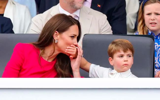 Prince Louis puts his hand to Princess Kates mouth