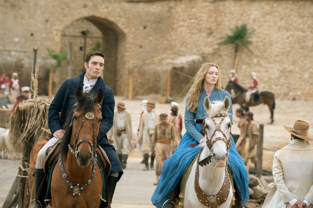 man and woman riding horses