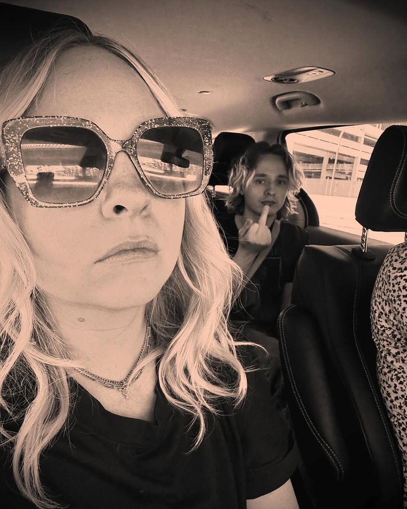 Georgia Tennant taking a selfie in the car with Ty