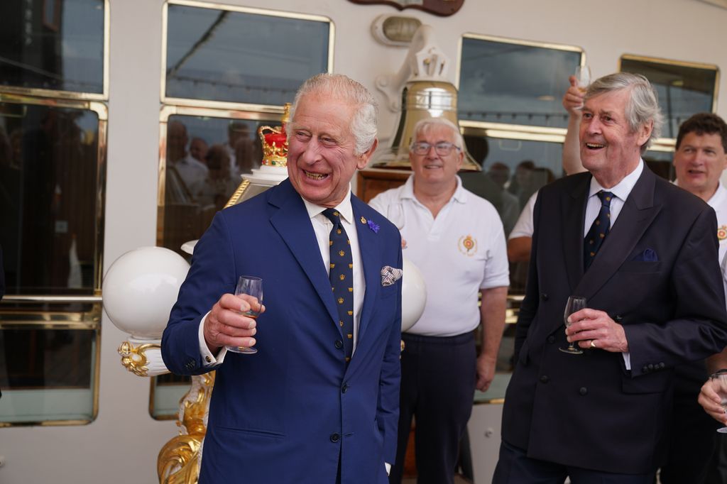 King Charles at a reception on the Royal Yacht Britannia