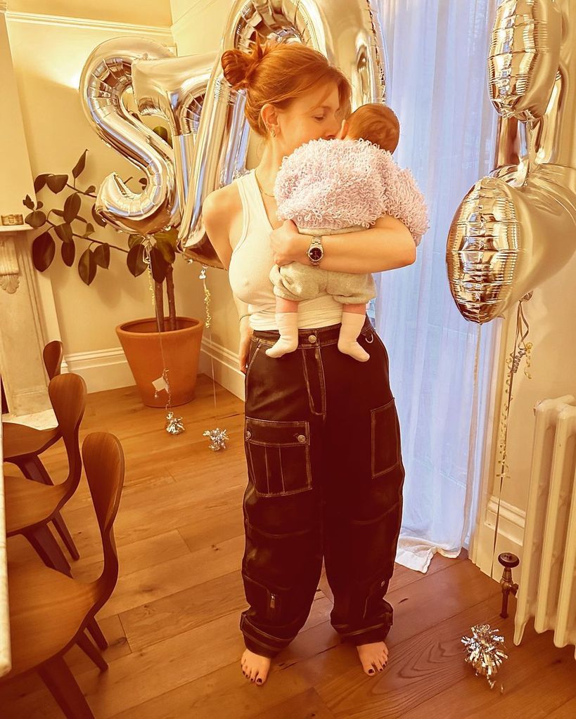 Stacey Dooley holding Minnie on her 36th birthday