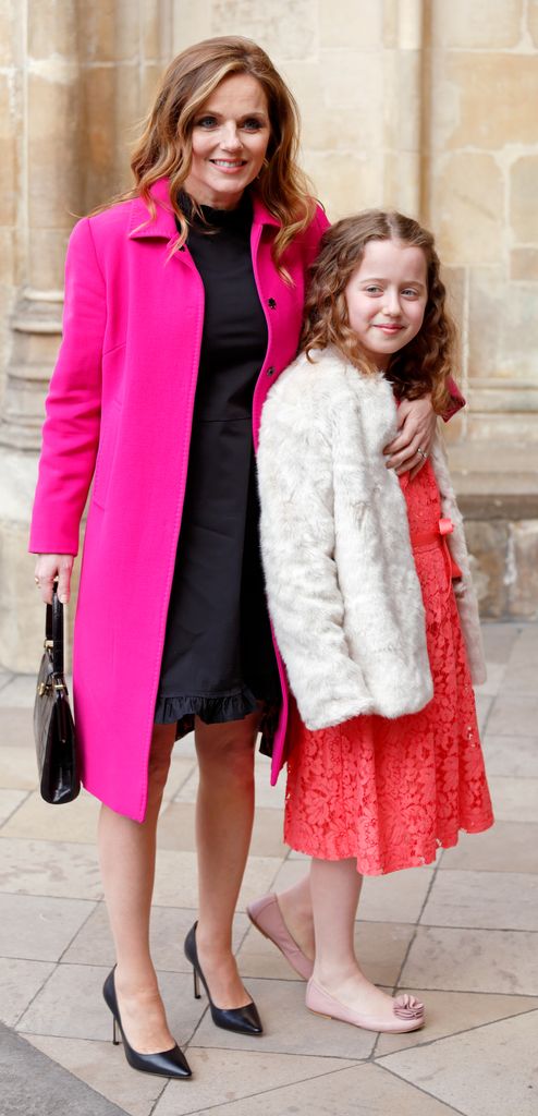 Geri Halliwell-Horner in a pink coat and daughter Bluebell in a red dress