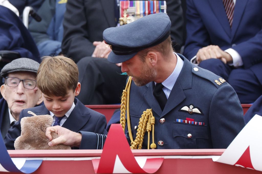 Prince Louis holding hot water bottle